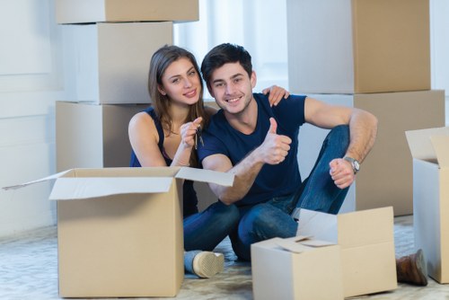 Local moving team loading furniture into a removals van